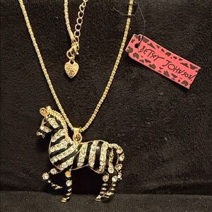 Betsey Johnson Gold and Black Zebra Pendant Necklace